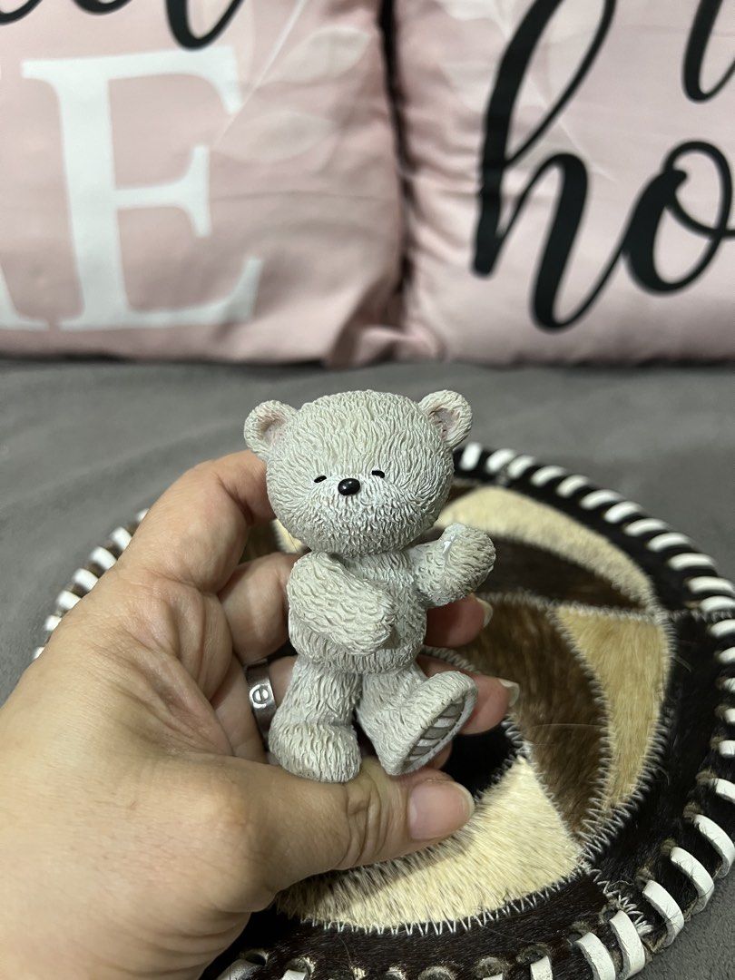 Cute Grey Teddy Bear Figurine on Decorative Mat (Category: Plushies & Soft Toys) located in Las Pinas. Submitted by maple0305 (Listing ID 1459464277, Image 2). Description: - Adorable grey bear figurine - Stands on a unique round mat - Mat features a patchwork fur design - Mat has a black and white striped edge - Ideal for shelf or desk decor - Great for collectors - Makes a sweet gift.