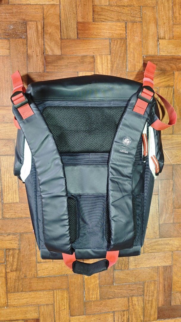 Delsey Paris Black Backpack with Red Accents (Category: Backpacks) located in Tarlac. Submitted by limidoloy191416 (Listing ID 1459491281, Image 3). Description: - Brand: Delsey Paris - Color: Black - Design: Red and white stripe details on the front - Comfort Features: Padded straps and mesh back panel - Closure: Top flap with buckle - Interior: Plenty of space for essentials - Ideal for: Daily use or travel.