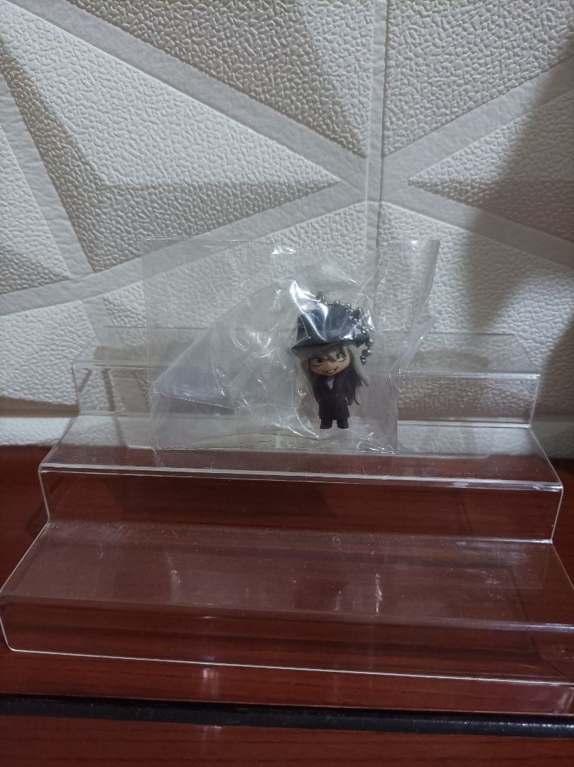 Detective Conan gin (Category: Character Goods) located in Bacoor. Submitted by kuroochiii94695 (Listing ID 1459313636, Image 1). Description: - Cute anime character keychain - Features a black hat and suit - Comes in original packaging - Ideal for decorating bags or keys - A small, collectible item.