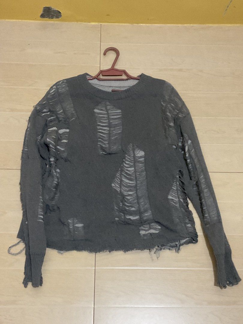 Distressed Knit Sweater cropped (Category: Coats, Jackets and Outerwear) located in Mabalacat. Submitted by epicforest_78284 (Listing ID 1459408451, Image 1). Description: - Grey distressed knit sweater - Features intentional rips and tears throughout - Long sleeves with ribbed cuffs - Raw hemline - Ideal for a grunge or edgy aesthetic.
