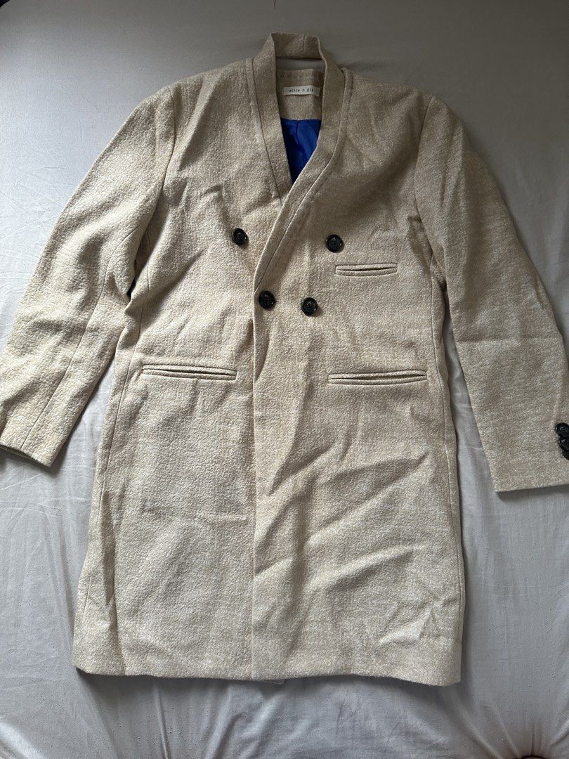 Double-breasted Beige Textured Coat with Blue Lining (Category: Coats, Jackets and Outerwear) located in Lipa City. Submitted by chiechums (Listing ID 1459331198, Image 1). Description: - Beige double-breasted coat - Textured fabric for a sophisticated look - Bright blue lining for a pop of color - Two front pockets for convenience - Back tab with button detail - Front button closure - Ideal for stylish layering.
