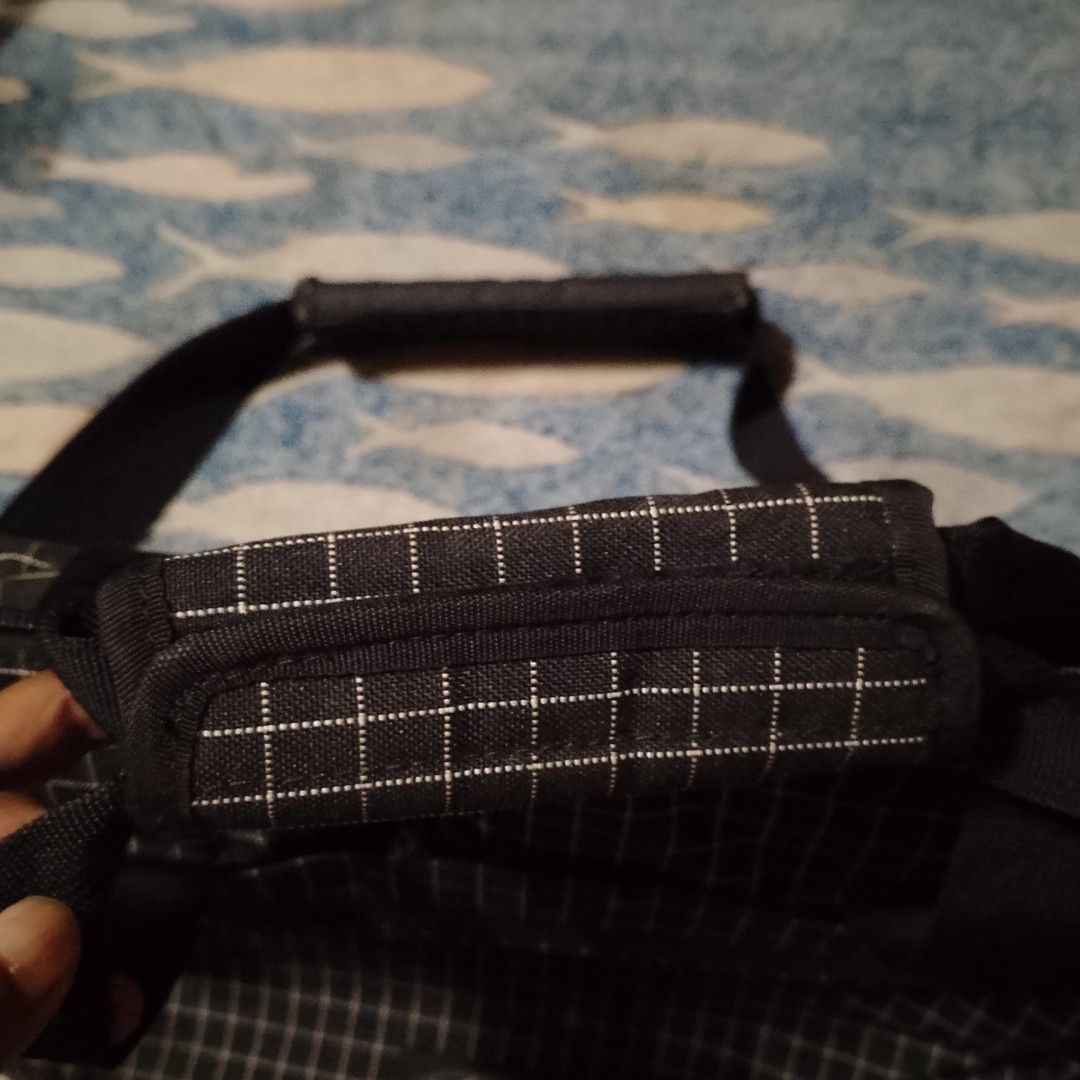 Eastpak Messenger Bag Black Grid Pattern (Category: Other Accessories) located in Antipolo. Submitted by jomavi20 (Listing ID 1459333394, Image 2). Description: - Black Eastpak messenger/ laptop bag - White grid pattern - Main zip compartment - Front zip pocket - Top handles - Detachable shoulder strap with padded rest - Ideal for daily use or laptop transport -mall bought -no flaws -waterproof.
