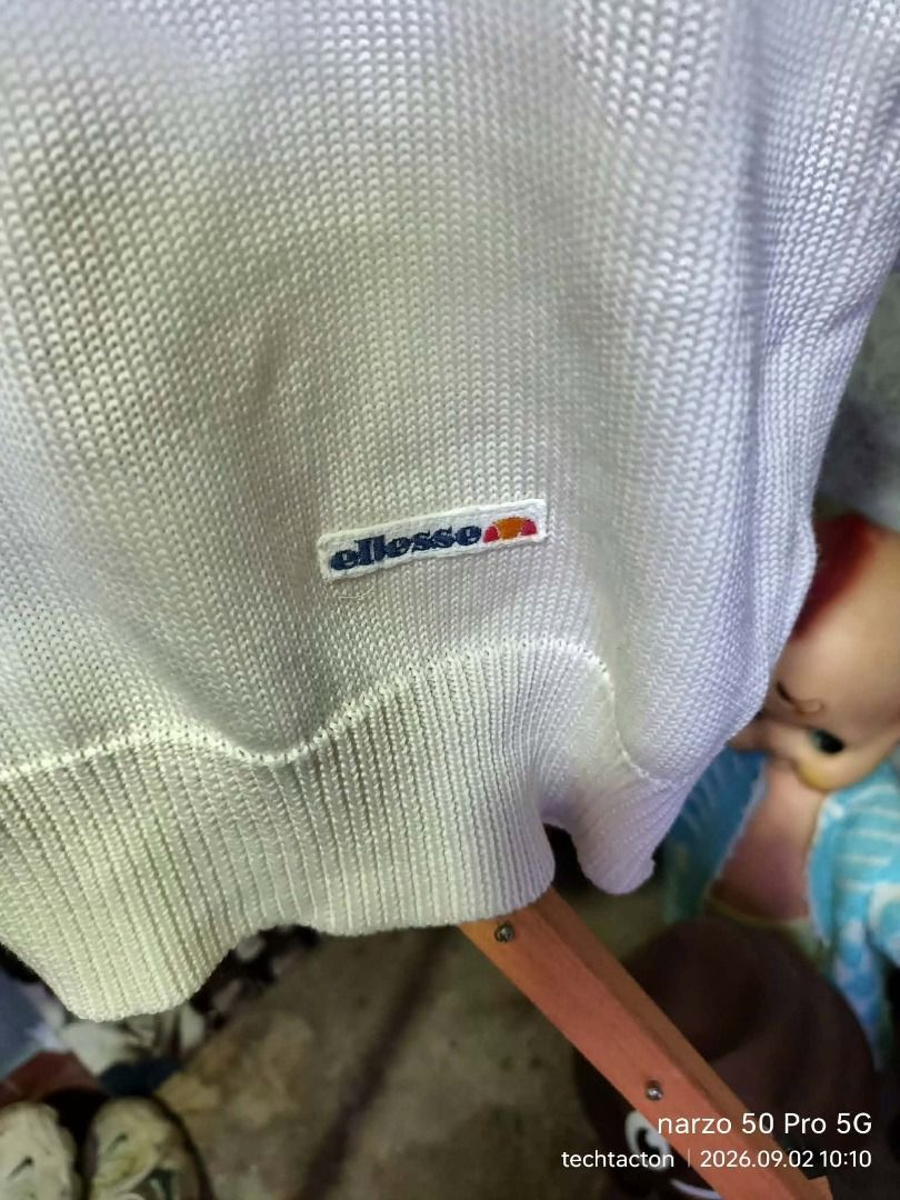 Ellesse White Knit Sweater (Category: Coats, Jackets and Outerwear) located in Santo Tomas. Submitted by pickers_corner (Listing ID 1459308205, Image 2). Description: vintage ELLESE knitted Sweater size JASPO L dime 20x24 Very good condition no holes no stain - Brand: Ellesse - Color: White - Style: Knit sweater - Features: Classic Ellesse logo patch on chest - Comfort: Comfortable and casual - Occasion: Great for everyday wear.