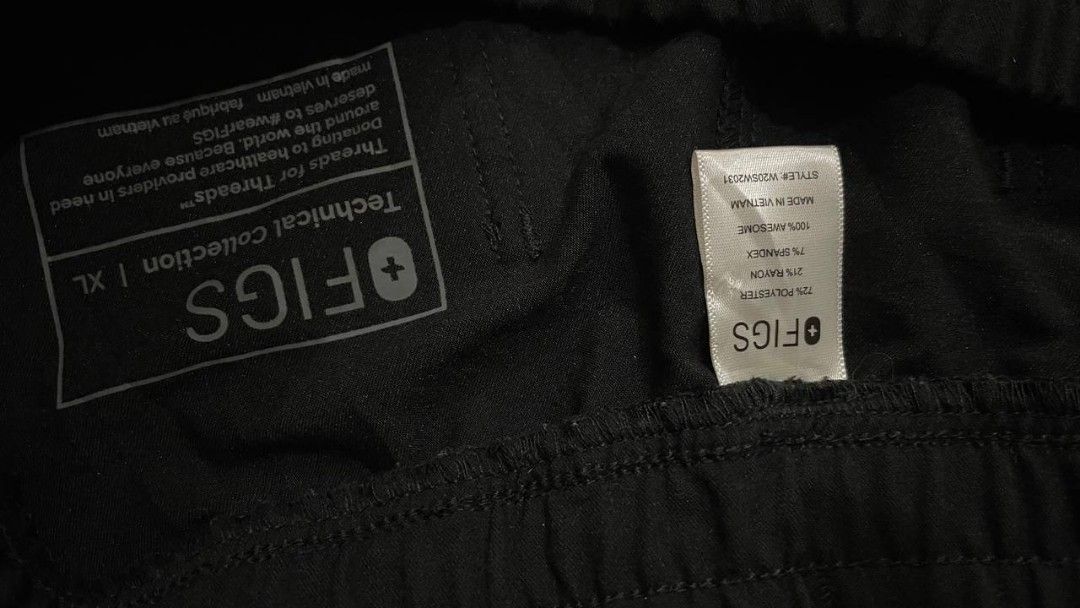FIGS Technical Scrub Pants, (Category: Activewear) located in Manila. Submitted by biniyayaan (Listing ID 1459307642, Image 3). Description: Adjustable Waistband: Features a relaxed elastic waist coupled with a contrasting white external drawstring for a secure fit. Storage & Utility Pockets: Equipped with functional slant pockets at the waist and a prominent zippered security pocket along the side leg. Straight-Leg Cut: Designed with a classic, 