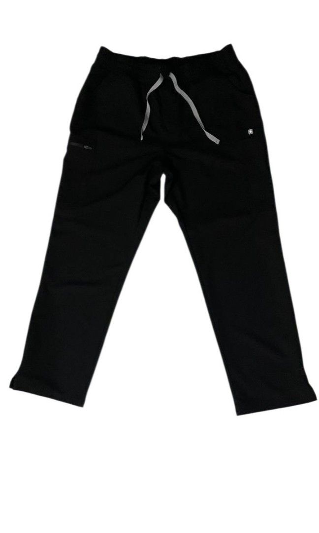FIGS Technical Scrub Pants, (Category: Activewear) located in Manila. Submitted by biniyayaan (Listing ID 1459307642, Image 1). Description: Adjustable Waistband: Features a relaxed elastic waist coupled with a contrasting white external drawstring for a secure fit. Storage & Utility Pockets: Equipped with functional slant pockets at the waist and a prominent zippered security pocket along the side leg. Straight-Leg Cut: Designed with a classic, 
