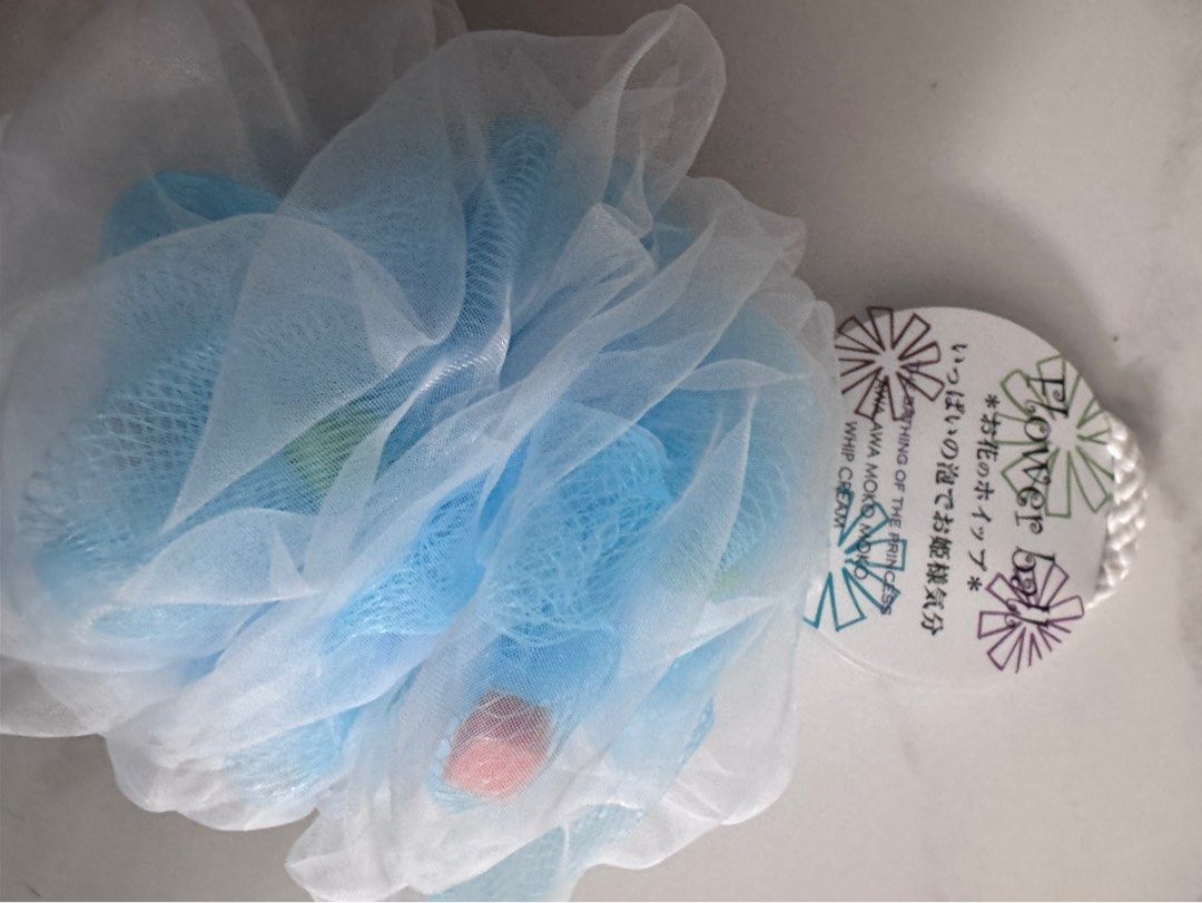 Flower Ball Bath Puff - Blue & White (Category: Bath) located in Manila. Submitted by decluterthings888 (Listing ID 1459394701, Image 1). Description: - Adorable flower ball design - Available in blue and white netting - Creates abundant lather for a luxurious bath experience - Perfect for gifting or personal indulgence.