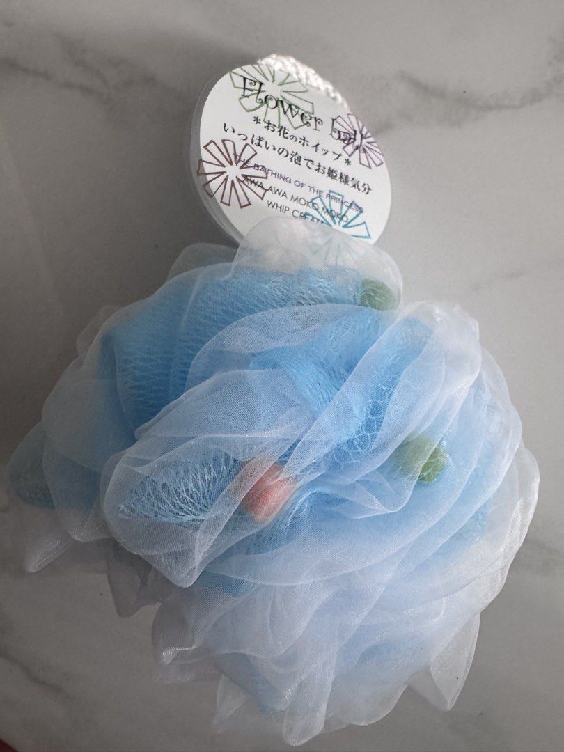 Flower Ball Bath Puff - Blue & White (Category: Bath) located in Manila. Submitted by decluterthings888 (Listing ID 1459394701, Image 3). Description: - Adorable flower ball design - Available in blue and white netting - Creates abundant lather for a luxurious bath experience - Perfect for gifting or personal indulgence.