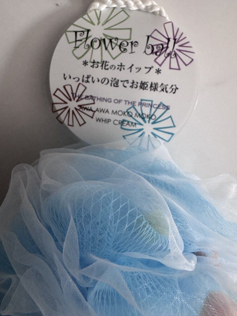Flower Ball Bath Puff - Blue & White (Category: Bath) located in Manila. Submitted by decluterthings888 (Listing ID 1459394701, Image 2). Description: - Adorable flower ball design - Available in blue and white netting - Creates abundant lather for a luxurious bath experience - Perfect for gifting or personal indulgence.
