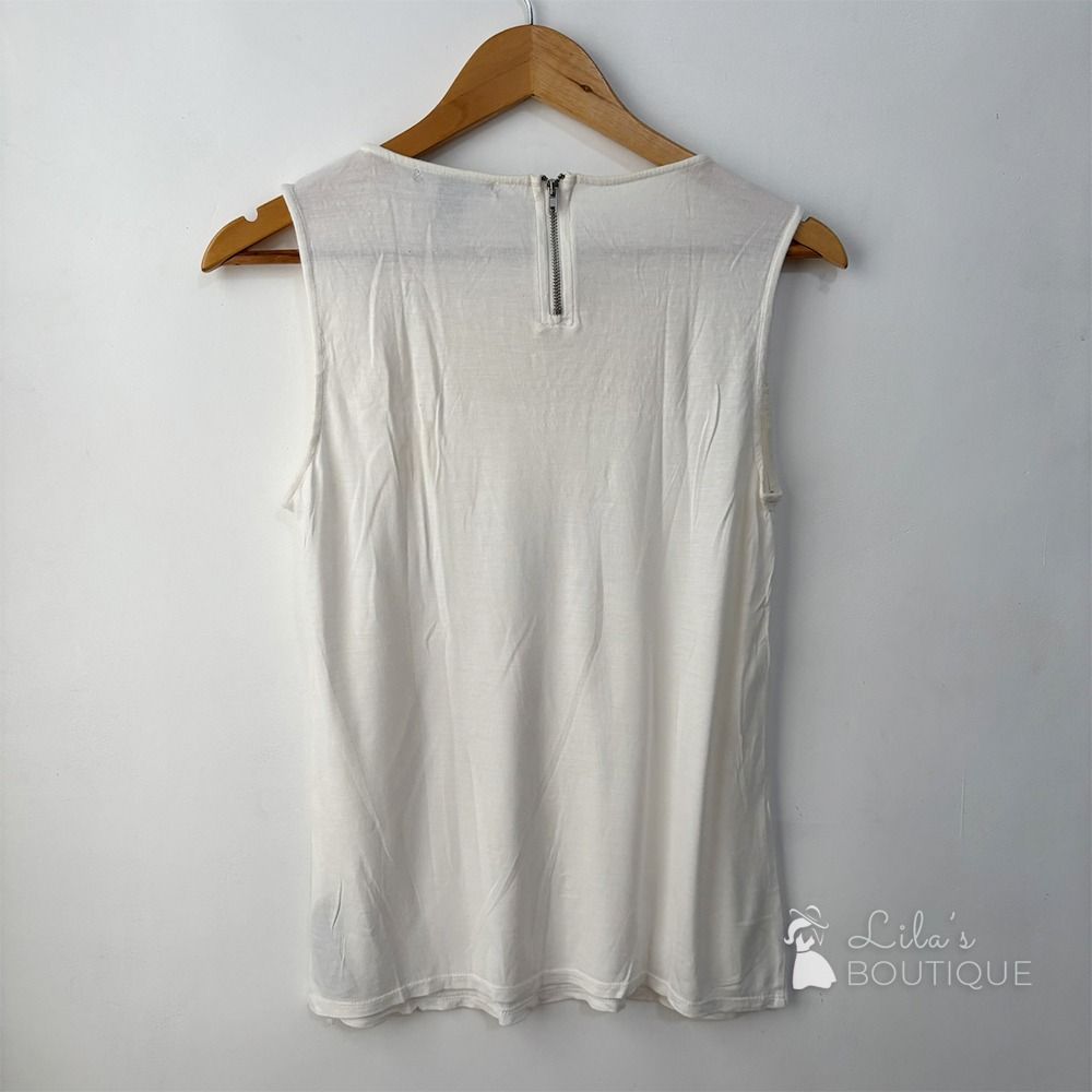 Forever 21 Sleeveless Lace Blouse (Category: Sleeveless) located in San Fernando. Submitted by lilasboutique (Listing ID 1459337578, Image 2). Description: Size: SMALL (S) Chest: 32 in | Length: 23 in Fit: Regular Details: • PRELOVED. Great Condition • Brand: Forever 21 • Color: Cream White.