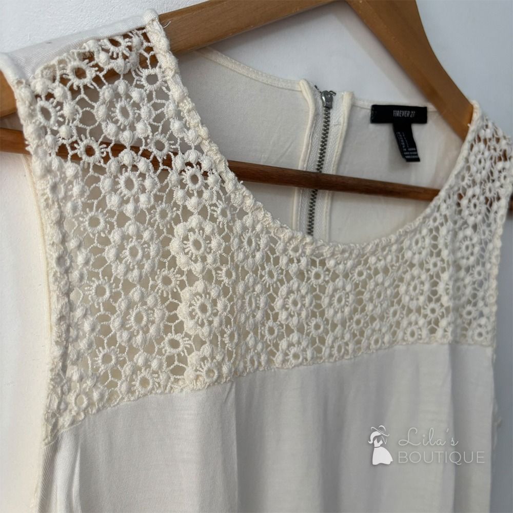 Forever 21 Sleeveless Lace Blouse (Category: Sleeveless) located in San Fernando. Submitted by lilasboutique (Listing ID 1459337578, Image 3). Description: Size: SMALL (S) Chest: 32 in | Length: 23 in Fit: Regular Details: • PRELOVED. Great Condition • Brand: Forever 21 • Color: Cream White.