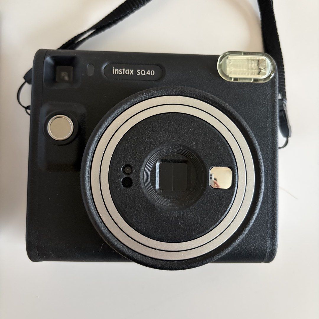 Fujifilm Instax SQUARE SQ40 Instant Camera (Category: Cameras) located in Quezon City. Submitted by secondhandlifestyle (Listing ID 1459295313, Image 2). Description: - Fujifilm Instax SQUARE SQ40 - Takes square instant photos - Comes with original box - Includes original strap - Easy to use - Great for capturing memories Purchased directly from Henry’s Camera for 8,999. Square film can be purchased there or from other film sellers MOP: BPI or GC