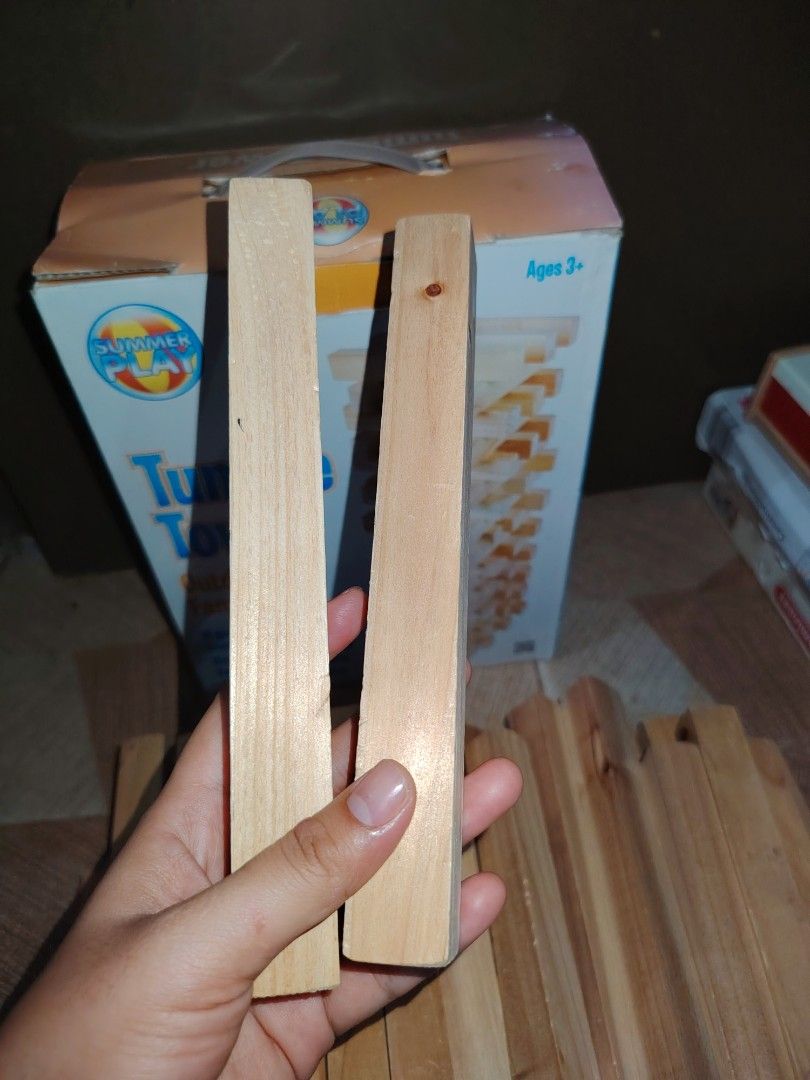 Giant Wooden Tumble Tower Preloved (Category: Board Games & Puzzles) located in Santiago. Submitted by aceheart0118672 (Listing ID 1459294479, Image 2). Description: - Giant Wooden Tumble Tower game - Preloved condition, ready for play - Includes all 52 hardwood blocks - Promotes balance and skill - Suitable for ages 3 and up - Great for outdoor and family fun have signs of usage .