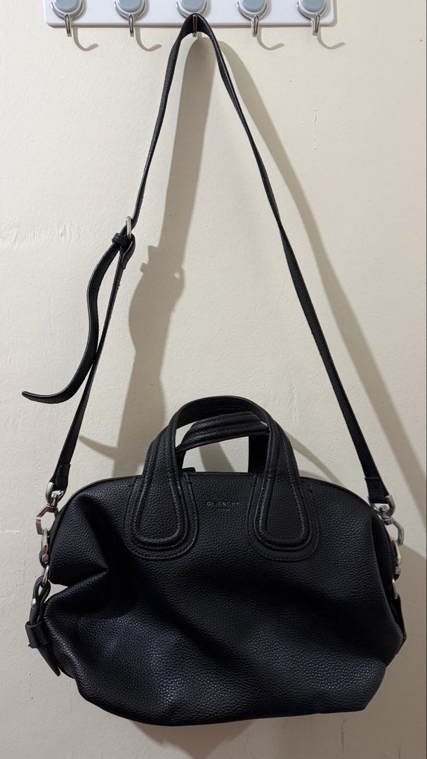 Givenchy Black Leather Crossbody Bag (Category: Cross-body Bags) located in Rizal. Submitted by lovegclothingph (Listing ID 1459410775, Image 1). Description: - Givenchy Antigona Lock shoulder bag - Color: Black - Material: Leather - Design: Antigona Lock - Features: Top handles and detachable shoulder strap - Hardware: Silver-tone - Interior: Spacious, ideal for essentials - Versatile: Suitable for daily use and evening events - With minimal sig