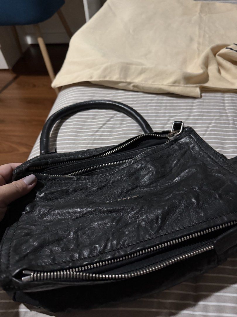 Givenchy Black Leather Pandora Bag (Category: Luxury Bags & Wallets) located in Rizal. Submitted by nhacio06 (Listing ID 1459405533, Image 1). Description: - Authentic Givenchy Pandora Bag - Color: Black - Material: Sheepskin Leather - Origin: Made in Italy - Features: Top handle, zip closure - Interior: Spacious, great for everyday essentials Slightly negotiable Guaranteed authentic Rfs: decluttering .
