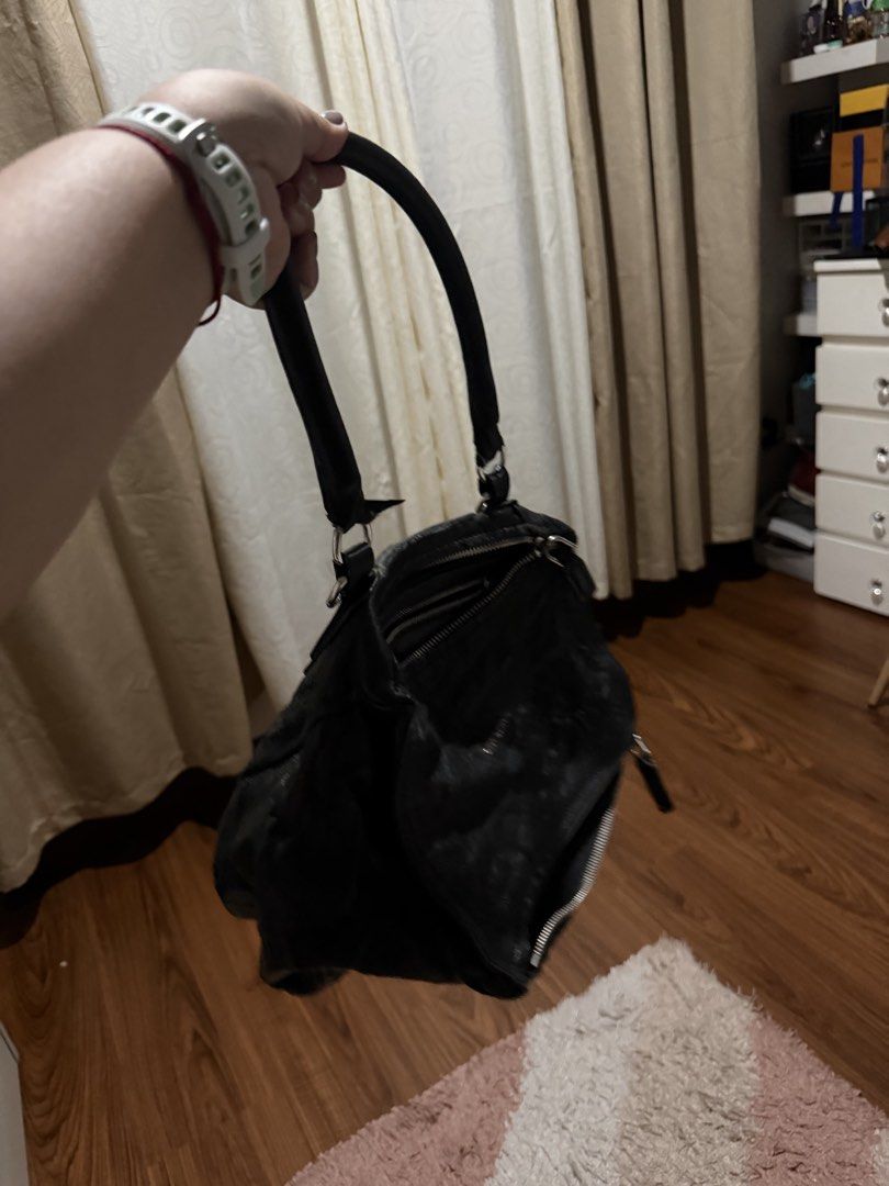 Givenchy Black Leather Pandora Bag (Category: Luxury Bags & Wallets) located in Rizal. Submitted by nhacio06 (Listing ID 1459405533, Image 2). Description: - Authentic Givenchy Pandora Bag - Color: Black - Material: Sheepskin Leather - Origin: Made in Italy - Features: Top handle, zip closure - Interior: Spacious, great for everyday essentials Slightly negotiable Guaranteed authentic Rfs: decluttering .