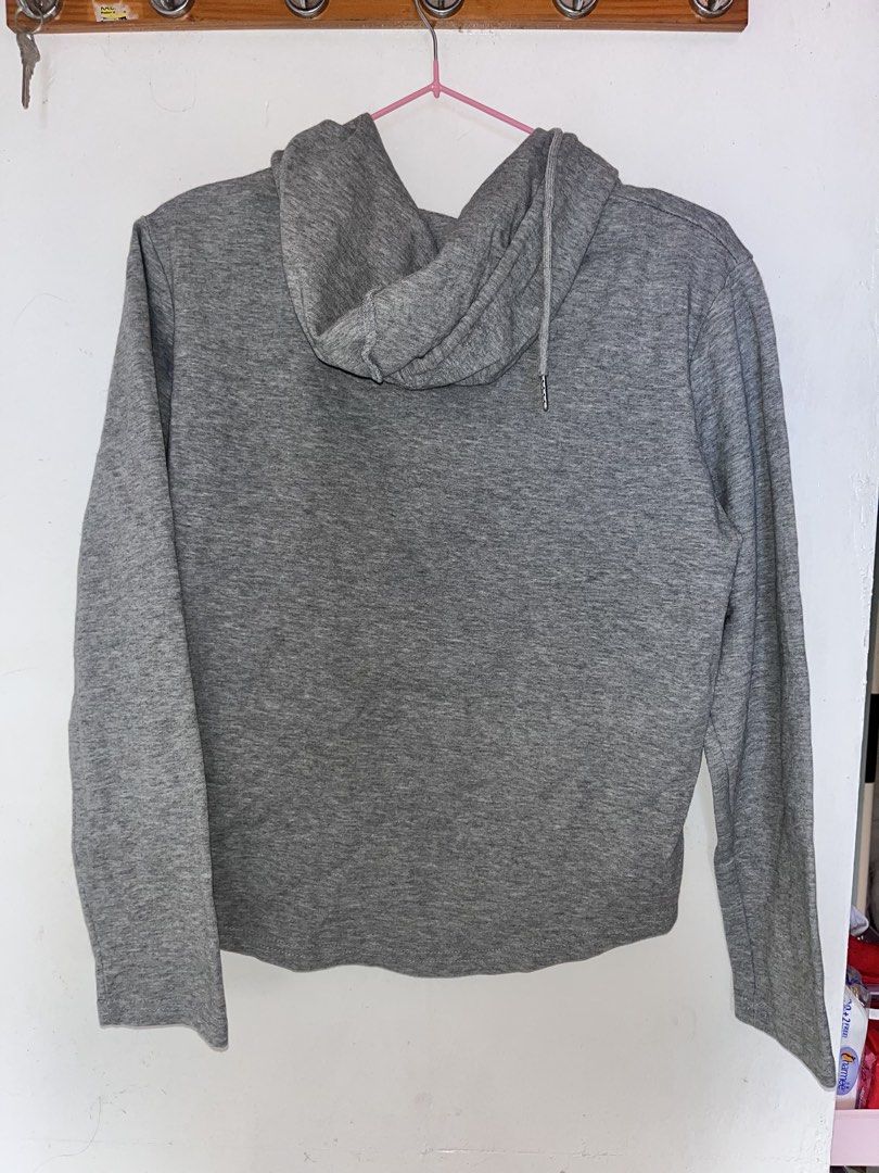 Grey Cropped Zip-Up Hoodie (Category: Coats, Jackets and Outerwear) located in Manila. Submitted by watchap.ketchup (Listing ID 1459299815, Image 2). Description: - Grey cropped hoodie - Zip-up front - Long sleeves - Drawstring hood - Simple and comfortable design - Ideal for casual wear - Pairs well with jeans or shorts.