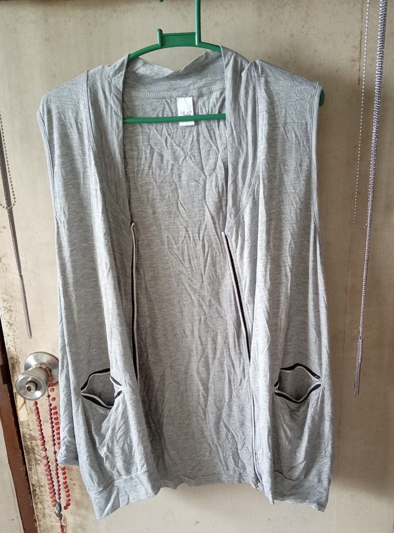 Grey Sleeveless Zip-Up Vest with Pockets (Category: Coats, Jackets and Outerwear) located in Quezon City. Submitted by chacha30.s (Listing ID 1459362418, Image 3). Description: - Grey sleeveless vest - Zip-up front closure - Two front pockets with black trim - Soft and flowy material - Ideal for layering over tops - Easy to wear and style - Comfortable for casual outings . Text me at 09277152134 . Buy na po kayo/Offer lang po kayooo. . Bili na po