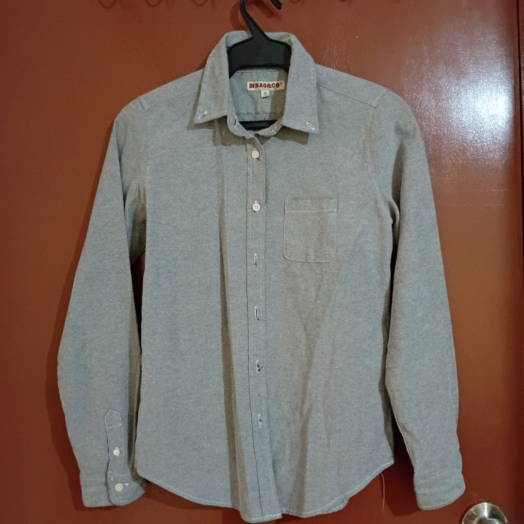 Grey Women's Polo (Medium) (Category: Longsleeves) located in Silang. Submitted by trish125 (Listing ID 1459305207, Image 1). Description: Sakto fit sakin I'm 5'0 and 29 waistline w/ slight allowance in length (see last pic) - Brand: DEBA&CO - Color: Grey - Style: Long-sleeved button-up shirt - Features: Single chest pocket, button front closure, button cuffs - Size: M - Occasion: Casual wear.