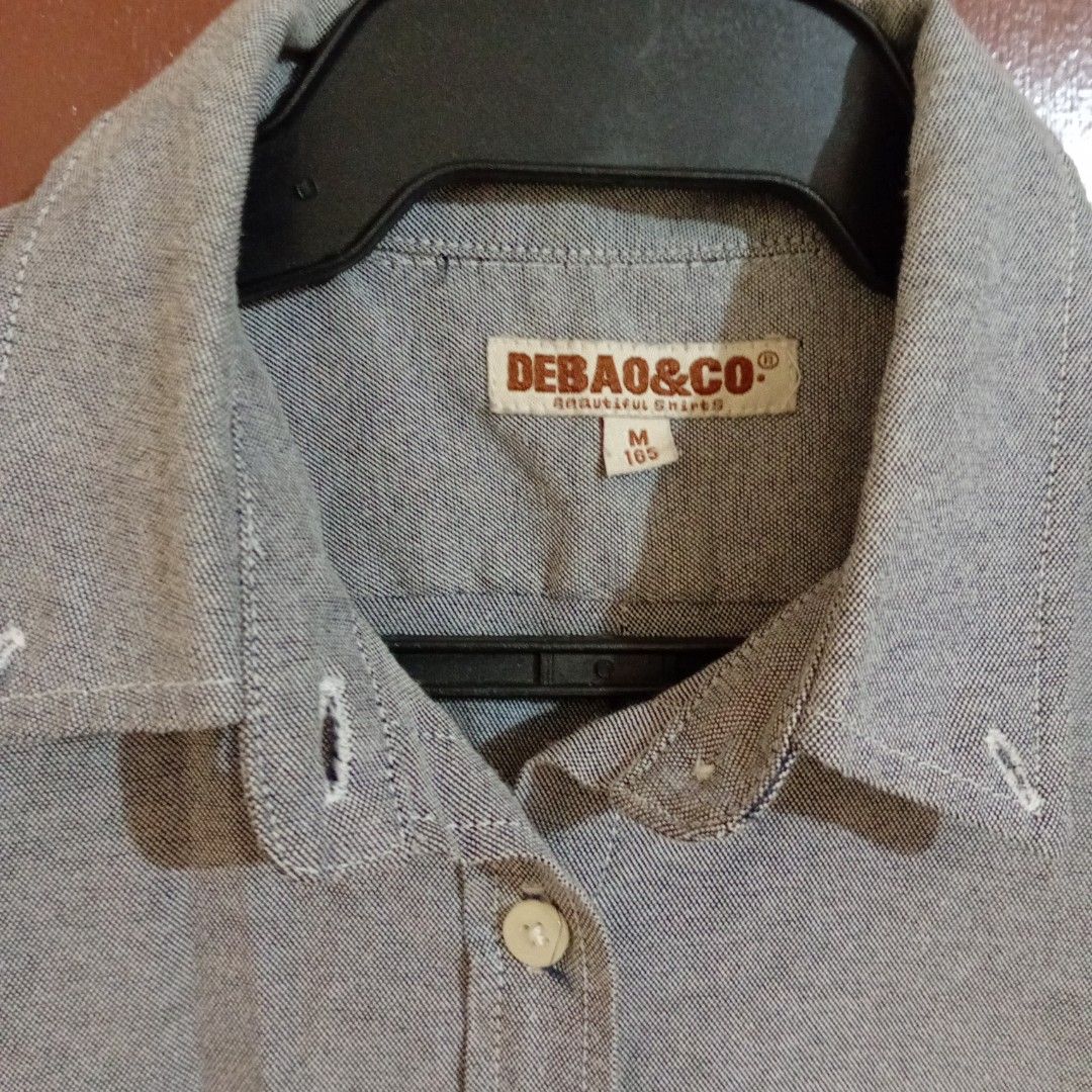 Grey Women's Polo (Medium) (Category: Longsleeves) located in Silang. Submitted by trish125 (Listing ID 1459305207, Image 3). Description: Sakto fit sakin I'm 5'0 and 29 waistline w/ slight allowance in length (see last pic) - Brand: DEBA&CO - Color: Grey - Style: Long-sleeved button-up shirt - Features: Single chest pocket, button front closure, button cuffs - Size: M - Occasion: Casual wear.