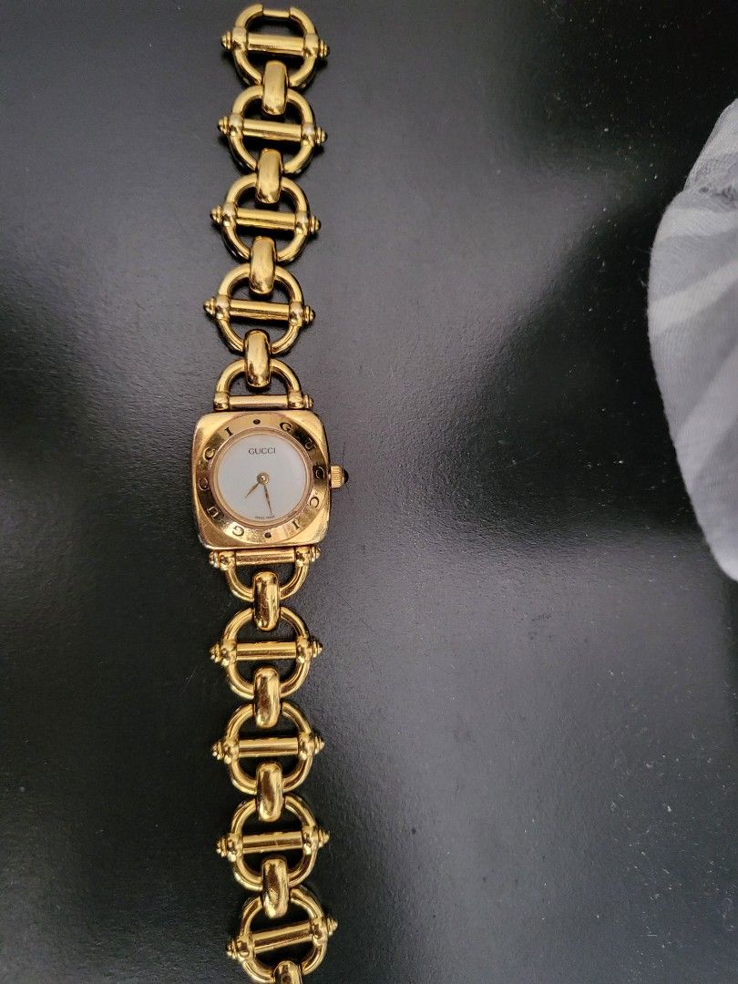 Gucci 18k Gold Plated Watch (Category: Women's Watches) located in Mandaluyong City. Submitted by cess_badinas (Listing ID 1459294448, Image 1). Description: - Vintage Gucci 6400L watch - Year 1990 Model - Gold plated with mother of pearl face - Iconic Gucci horsebit link bracelet - White dial with gold hands and markers - Swiss made movement - In good working condition - A timeless collector's piece Hard Pass sa TAWAD. posted price is my Last Pr