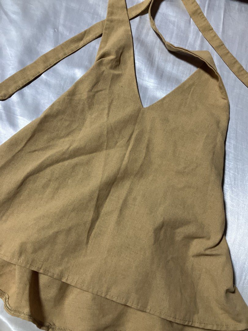 Halter Neck Top with Tie Straps (Category: Sleeveless) located in Caloocan City. Submitted by ahavastuff.ph (Listing ID 1459483831, Image 2). Description: Tan halter neck top with tie straps. Light, breathable fabric. No flaws.