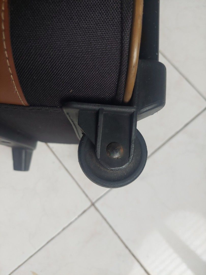 Handy Luggage (Category: Luggage) located in Cainta. Submitted by ceejay.lim (Listing ID 1459325469, Image 3). Description: - Stylish black and brown handy luggage for storage or travel - pls see photos carefully -design handle as is - L - 43cm W - 32cm Handle to wheels - 33cm.