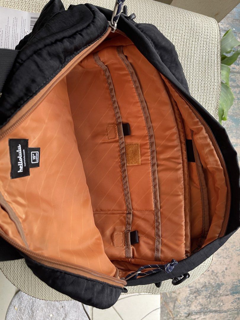 hellolulu Black Laptop Bag 15" Laptop Compartment (Category: Laptop Bags & Sleeves) located in Mandaluyong City. Submitted by coolmeybab (Listing ID 1459374213, Image 3). Description: - Stylish black Hellolulu bag - Padded compartment fits up to a 15" laptop - Vibrant orange interior lining - Multiple front pockets for easy organization - Adjustable shoulder strap for comfort - Perfect for daily commutes and travel.