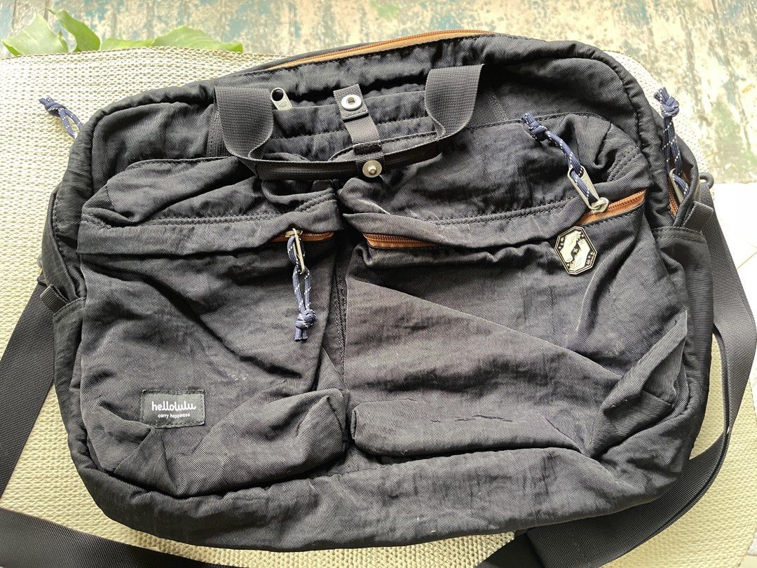 hellolulu Black Laptop Bag 15" Laptop Compartment (Category: Laptop Bags & Sleeves) located in Mandaluyong City. Submitted by coolmeybab (Listing ID 1459374213, Image 1). Description: - Stylish black Hellolulu bag - Padded compartment fits up to a 15" laptop - Vibrant orange interior lining - Multiple front pockets for easy organization - Adjustable shoulder strap for comfort - Perfect for daily commutes and travel.