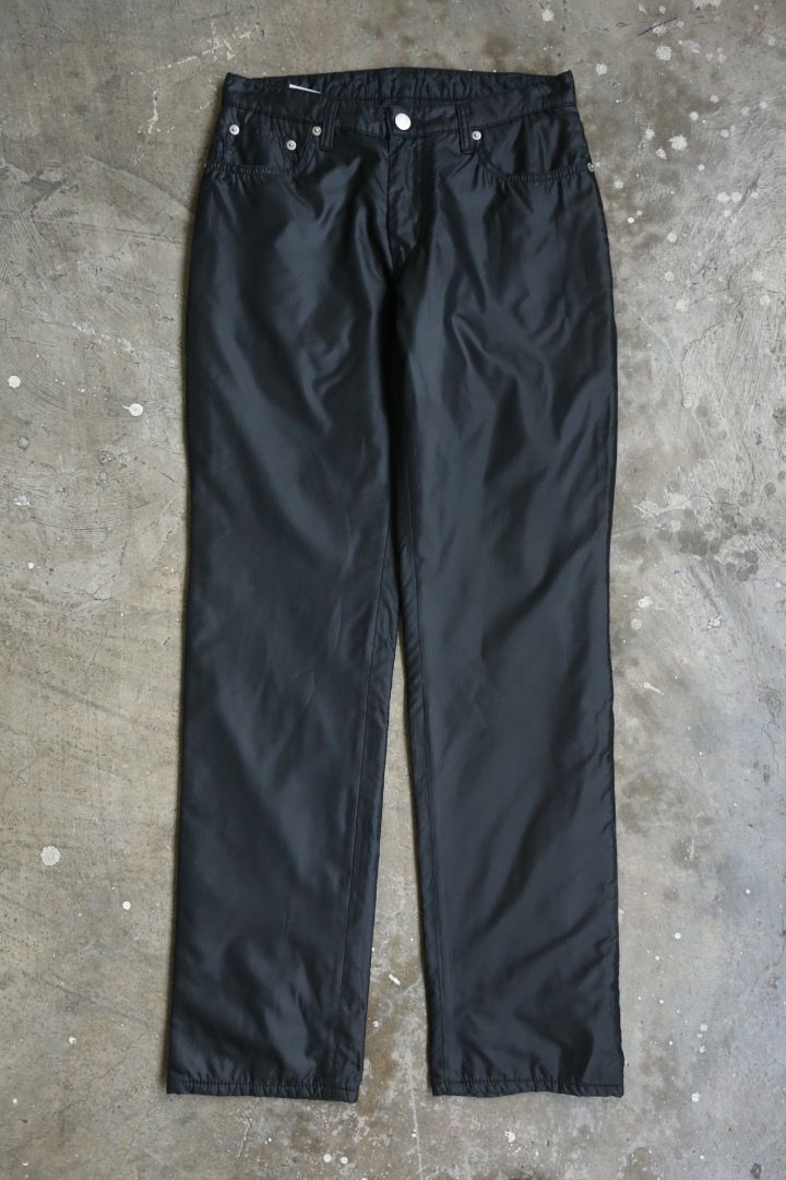 Helmut Lang - F/W 97 - Padded Pants (Category: Trousers) located in Manila. Submitted by graymatter_ (Listing ID 1459416328, Image 1). Description: Helmut Lang - F/W 97 - Padded Pants Tagged Size: 28 Condition: 9.5/10 Flaws: Minor Runs at Front Material: 100% Polyester Made in: Italy Dimensions Waist: 29 Inseam: 31 Crotch: 11 Thigh: 11 Leg Opening: 7.25 .