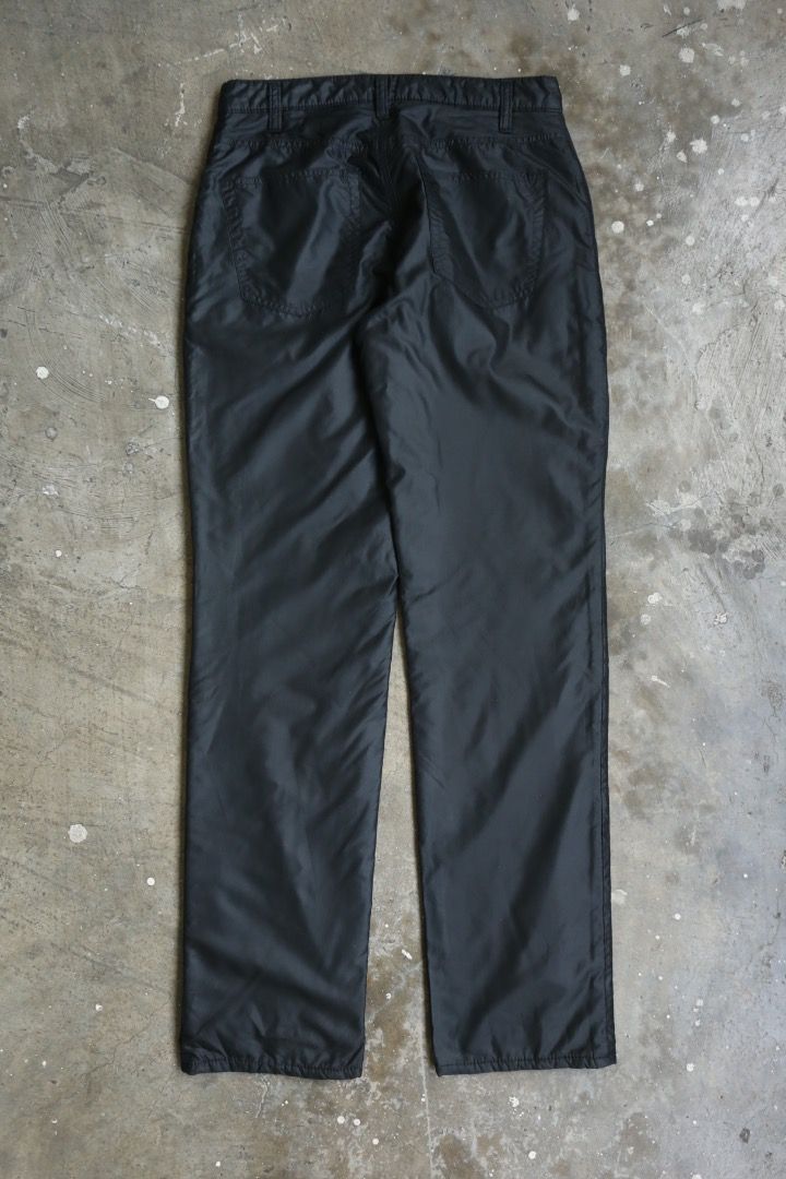 Helmut Lang - F/W 97 - Padded Pants (Category: Trousers) located in Manila. Submitted by graymatter_ (Listing ID 1459416328, Image 2). Description: Helmut Lang - F/W 97 - Padded Pants Tagged Size: 28 Condition: 9.5/10 Flaws: Minor Runs at Front Material: 100% Polyester Made in: Italy Dimensions Waist: 29 Inseam: 31 Crotch: 11 Thigh: 11 Leg Opening: 7.25 .