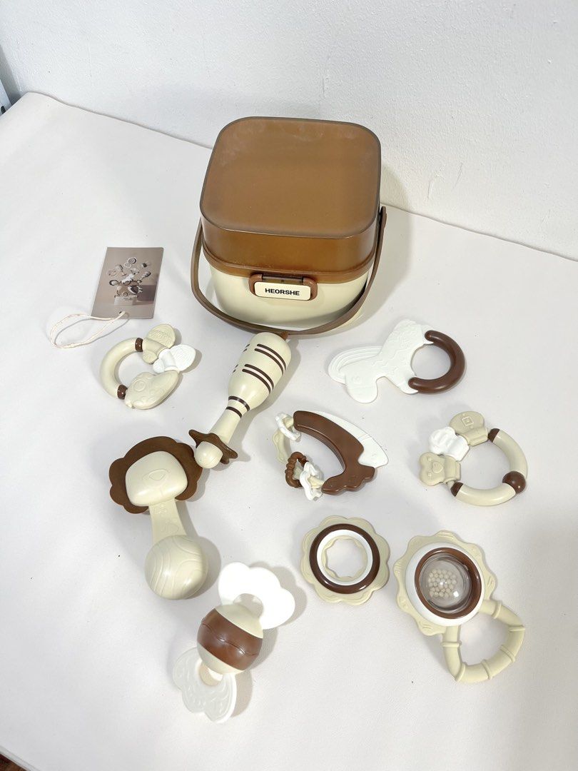 HEORSHE Baby Rattles and Teethers Set with Storage Case (Category: Infant Playtime) located in Pasig City. Submitted by decluterwithmee (Listing ID 1459401095, Image 3). Description: - HEORSHE brand baby rattle and teether set - Includes convenient storage case - Various shapes and sizes designed for little hands - Ideal for grasping, chewing, and sensory development - Helps soothe sore gums during teething - All pieces are accounted for (in case