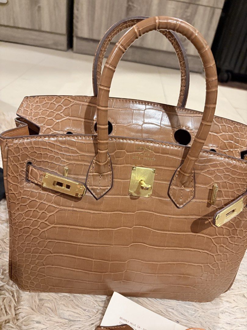 Hermes Birkin Crocodile Embossed Leather Handbag (Category: Luxury Bags & Wallets) located in Caloocan City. Submitted by fierce_mica29 (Listing ID 1459455423, Image 2). Description: - brown crocodile embossed leather handbag - Elegant gold hardware details - Includes detachable shoulder strap - Comes with lock and keys - cards included - made in France.