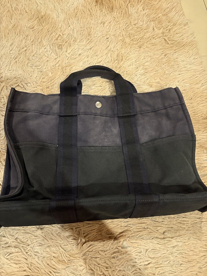 AUTHENTIC Hermes Tout Canvas Tote bag (Category: Luxury Bags & Wallets) located in Caloocan City. Submitted by fierce_mica29 (Listing ID 1459457684, Image 1). Description: - Authentic Hermes Tout Bag tote bag - Made in France - 100% cotton material - Iconic Hermes horse and carriage logo - Hermes zipper pull - Perfect for everyday use - Spacious and durable design.