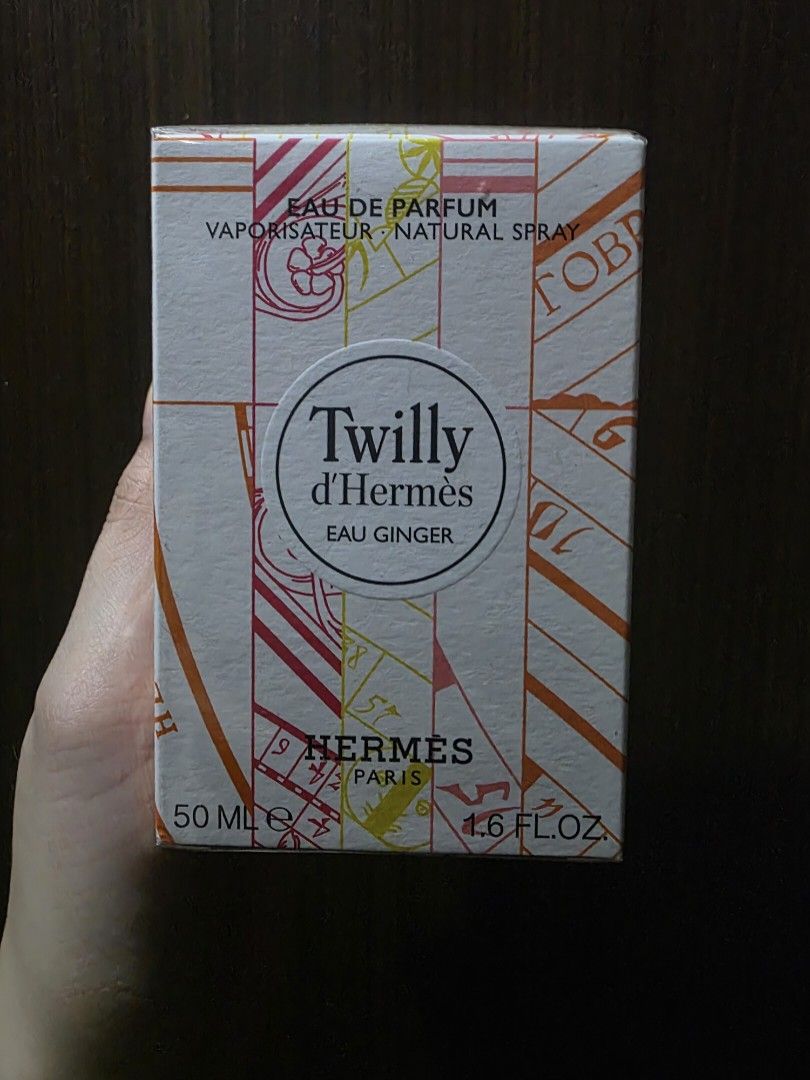 HERMÈS - Twilly D'hermes Eau Ginger Eau De Parfum Spray 50ml/1.6oz (Authentic) (Category: Fragrance & Deodorants) located in Manila. Submitted by dcory (Listing ID 1459431095, Image 2). Description: - A floral woody fragrance for modern women - Fresh, spicy, bright, milky, warm & uplifting Top note is peony - Middle notes are ginger & candied ginger - Base note is cedar - Launched in 2021 - Recommended for spring or summer wear - Presented in a g