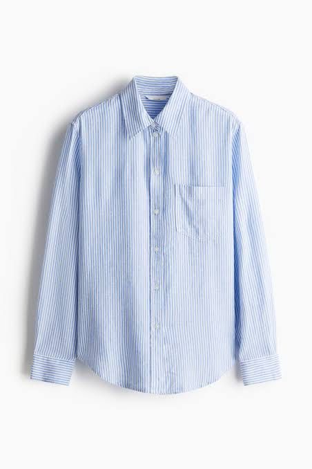 H&M Pinstriped Blue Polo Longsleeve (Category: Longsleeves) located in Binan City. Submitted by myprelovedhaul (Listing ID 1459409827, Image 1). Description: The item in the image is a light blue and white fine pinstriped button-down shirt from H&M. It features a classic spread collar, a left patch pocket, long sleeves with buttoned cuffs, and a gently rounded hemline..