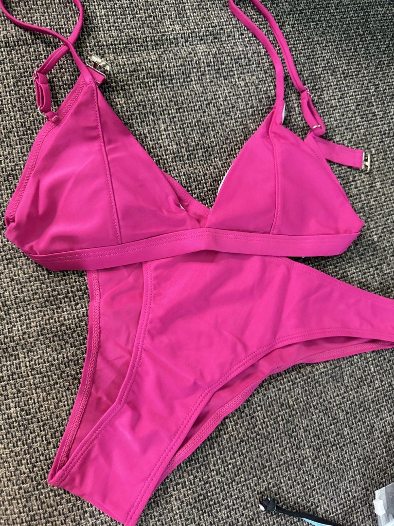 Hot Pink Triangle Bikini Set Size M (Category: Bikinis & Swimsuits) located in Taguig. Submitted by camillequi11890 (Listing ID 1459329923, Image 1). Description: - Vibrant hot pink bikini set - Triangle top with adjustable straps for a perfect fit - Flattering high-cut bottoms - Crafted from a comfortable 82% Nylon, 18% Spandex blend - Ideal for beach days, pool parties, and soaking up the sun - Stylish and comfortable design - xs-s if maliit di