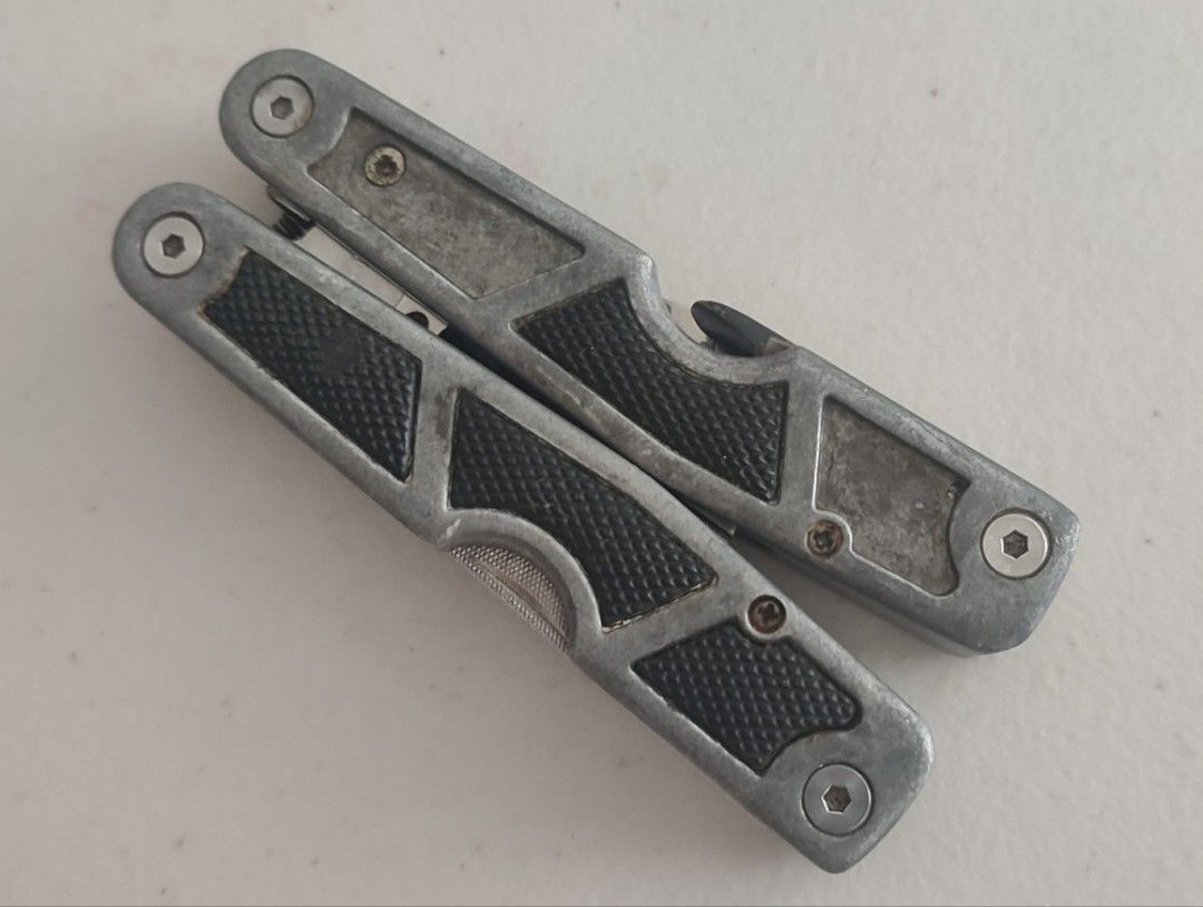Husky Multi Tool 10-1 Leatherman Pliers (Category: Home Improvement Tools & Accessories) located in Manila. Submitted by dampotmnl (Listing ID 1459481687, Image 2). Description: - Husky Multi-tool - Stainless Steel Construction - Features: Pliers, Knife, Bottle Opener, Ruler - Compact and handy for various tasks - Perfect for your toolbox or emergency kit.