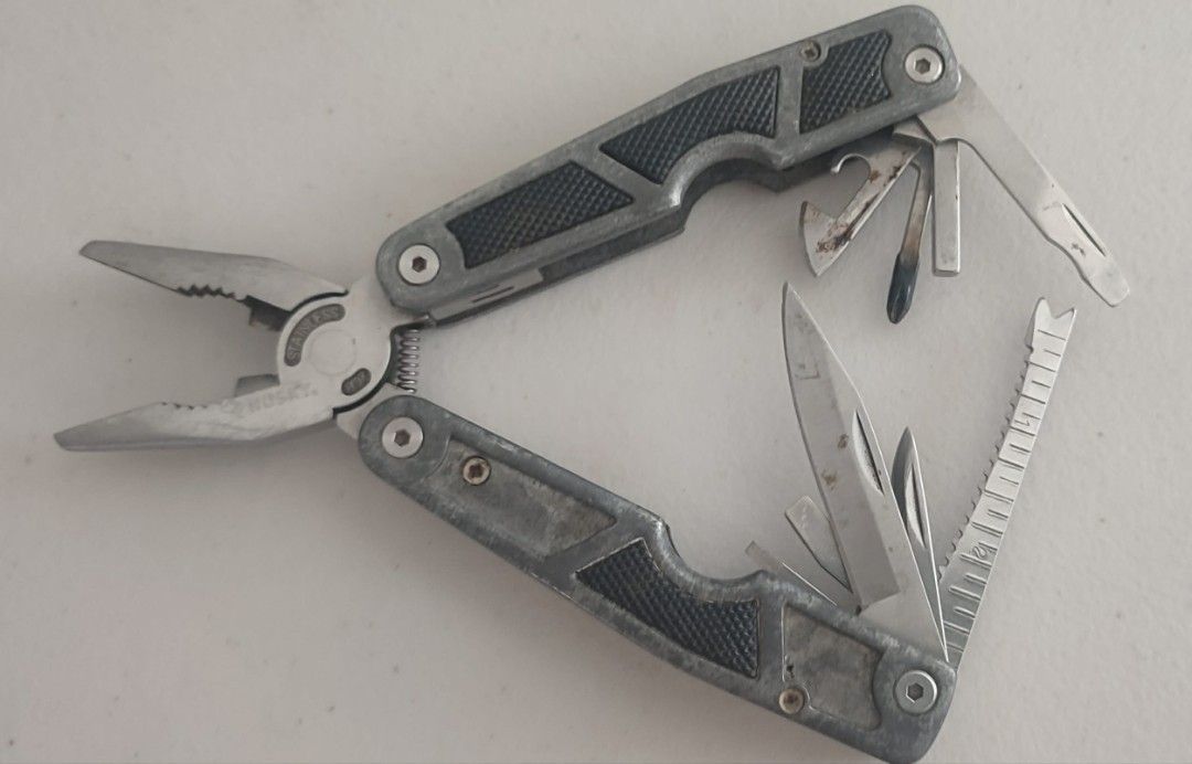 Husky Multi Tool 10-1 Leatherman Pliers (Category: Home Improvement Tools & Accessories) located in Manila. Submitted by dampotmnl (Listing ID 1459481687, Image 1). Description: - Husky Multi-tool - Stainless Steel Construction - Features: Pliers, Knife, Bottle Opener, Ruler - Compact and handy for various tasks - Perfect for your toolbox or emergency kit.