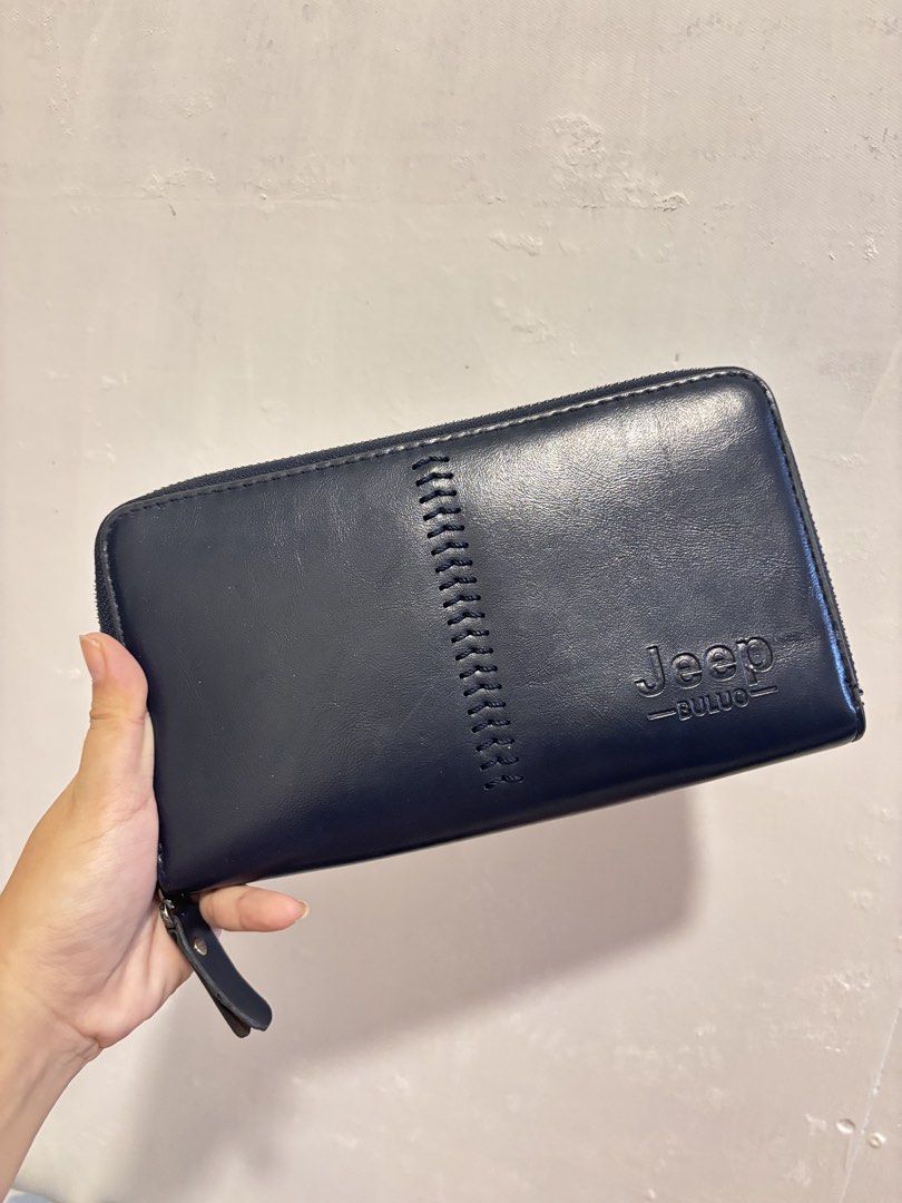 Jeep Buluo Navy Blue Zip Around Wallet (Category: Wallets & Card holders) located in Lapu Lapu. Submitted by affordmo (Listing ID 1459332637, Image 1). Description: - Navy blue Jeep Buluo wallet - Zip-around closure for security - Stylish stitched detail on the front - Generous interior space for cards and cash - Ideal for everyday use.