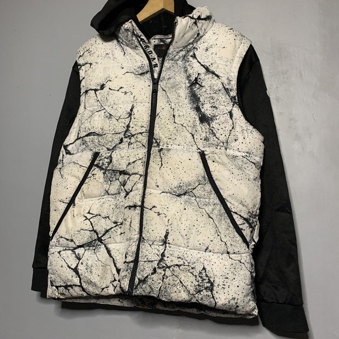 Jordan Puffer Jacket White Black Crackle Print (Category: Coats, Jackets and Outerwear) located in Manila. Submitted by emplysthrift. (Listing ID 1459375300, Image 2). Description: - Cool Jordan puffer jacket - Unique white and black crackle print design - Black sleeves and hood - Zip-up front with pockets - Perfect for staying warm and stylish - A must-have for any Jordan fan Jordan Puffer Jacket White Black Crackle Print Width "20 Length "24 Ex