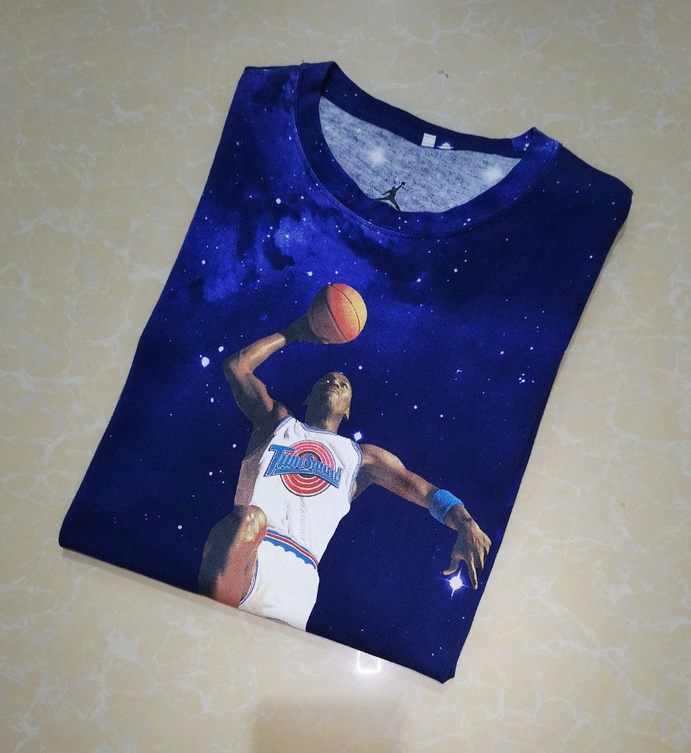 Jordan Space Jam T-Shirt Galaxy Print (Category: Tshirts & Polo Shirts ) located in Manila. Submitted by purefire-477a (Listing ID 1459352764, Image 2). Description: - Cool graphic tee featuring Michael Jordan in Space Jam. - All-over galaxy and star print. - Statement piece. - Size: Medium (M). - Ideal for basketball and Jordan fans. - Unique and eye-catching design..