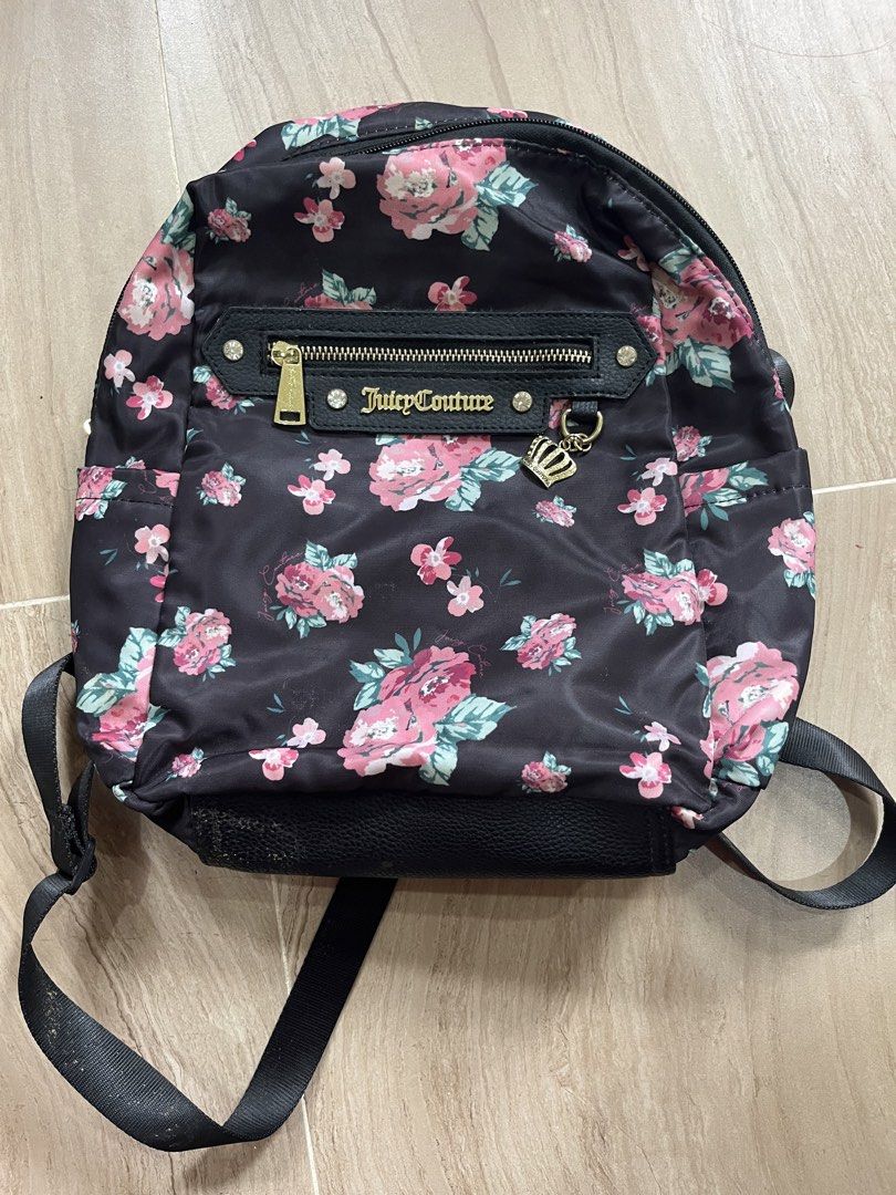 Juicy Couture Floral Backpack (Category: Backpacks) located in San Manuel. Submitted by richcande (Listing ID 1459299442, Image 1). Description: - Cute Juicy Couture backpack - Black base with pink floral print - Front zip pocket - Adjustable straps - Interior lining with all-over Juicy Couture logo - Ideal for everyday use or travel.