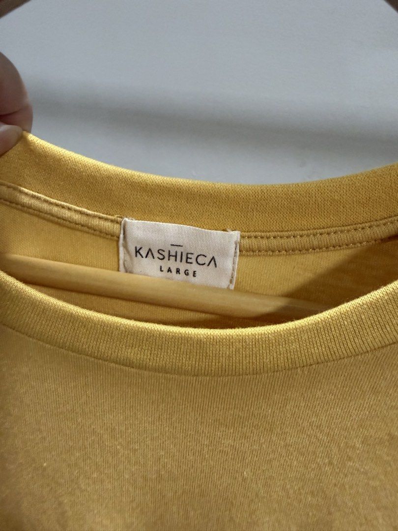 Kashieca Yellow Blouse (Category: Shirts) located in Taguig. Submitted by dyaaanel (Listing ID 1459337571, Image 3). Description: 💛 Kashieca Yellow Blouse with Garterized Bottom ✨ Selling Price: ₱350 🏷️ Brand: Kashieca 👗 Size: Large — can fit up to X 💛 Color: Yellow 🏷️ Condition: Good. No visible signs of usage 📸 Actual photos for reference. RFS: Decluttering unused and slightly used clothes Disclaimer: This item is pre-loved unless stated 