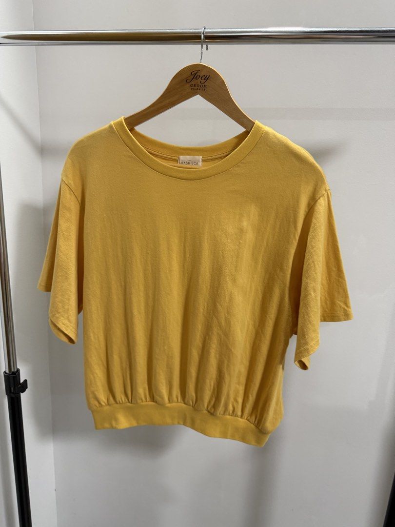 Kashieca Yellow Blouse (Category: Shirts) located in Taguig. Submitted by dyaaanel (Listing ID 1459337571, Image 1). Description: 💛 Kashieca Yellow Blouse with Garterized Bottom ✨ Selling Price: ₱350 🏷️ Brand: Kashieca 👗 Size: Large — can fit up to X 💛 Color: Yellow 🏷️ Condition: Good. No visible signs of usage 📸 Actual photos for reference. RFS: Decluttering unused and slightly used clothes Disclaimer: This item is pre-loved unless stated 