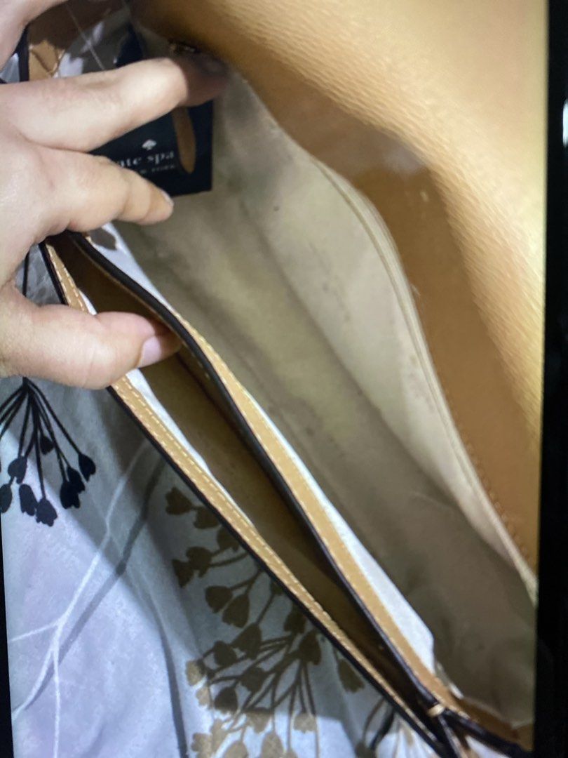 Kate Spade Leather Shoulder Bag - Tan (Category: Luxury Bags & Wallets) located in Manila. Submitted by DECLUTTERWITHADA (Listing ID 1459384678, Image 3). Description: - Authentic Kate Spade tan leather shoulder bag - Classic and simple design - Main compartment with an internal pocket - Adjustable strap with stylish chain details - Ideal for everyday use - Original retail price: $339.99.