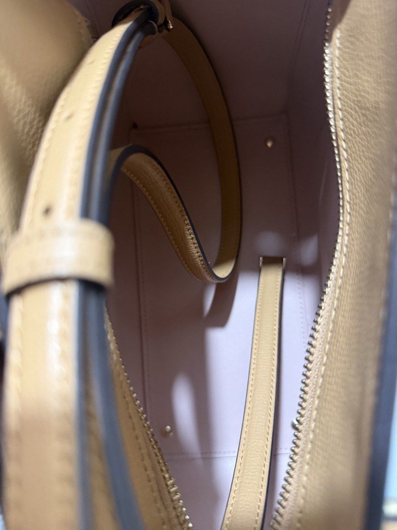 Kate Spade Satchel Bag (Category: Cross-body Bags) located in Manila. Submitted by muggles_closet (Listing ID 1459355699, Image 3). Description: Kate Spade New York Phoebe Satchel in a warm tan refined grain leather, featuring a distinctive metallic turn-lock closure on the front. Measurements 10.67” D Strap Drop: 4.53” Handle Drop: 4.5” Features Strap Drop: 22” Metal Pinmount Logo Closure Type: turn lock closure Exterior: front slip pocket Mater