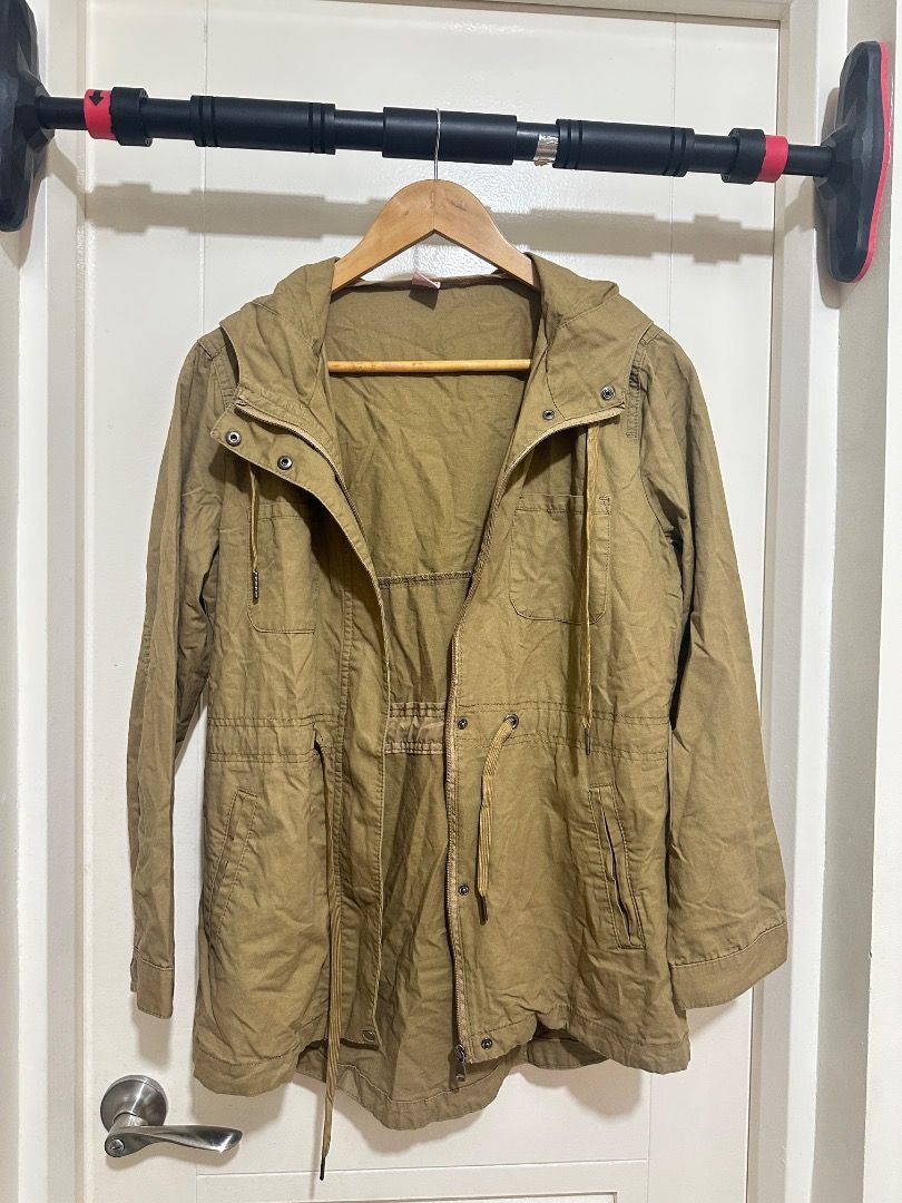 Khaki Utility Jacket Medium (Category: Coats, Jackets and Outerwear) located in Mandaluyong City. Submitted by lovedbyjaaaam (Listing ID 1459301291, Image 1). Description: - Brand: red girl - Color: Khaki - Size: Medium - Closure: Zip and button front - Features: Drawstring waist for adjustable fit, multiple front pockets - Style: Utility jacket, great for layering.