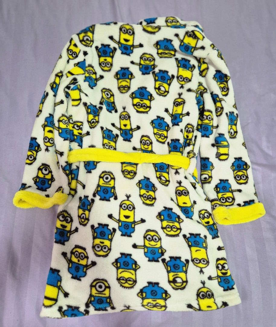 Bath Robe with Hood by Minion (Category: Babies & Kids Fashion) located in Manila. Submitted by sorayabarr50152 (Listing ID 1459371837, Image 2). Description: - Adorable Minion robe for kids - Fun all-over Minion character print - Hooded design for extra warmth - Includes a tie belt for a secure and snug fit - Bright yellow trim and belt for a pop of color - Made from soft and cozy material - Ideal for bath time, pool, or lounging at home.