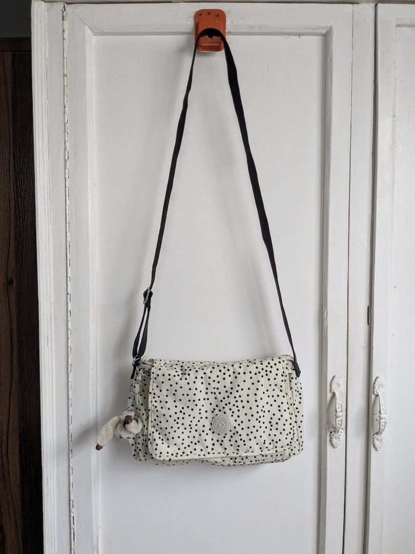 Kipling Syro Soft Dot Crossbody Bag (Category: Cross-body Bags) located in Quezon City. Submitted by nnncorner (Listing ID 1459321204, Image 1). Description: Original Kipling Syro Soft Dot Crossbody Bag Clean inside and outside No any issues Good as new! 100% Original! Strap down to bottom - 35 inches adjustable Length - 9 inches Width - 13 inches Original price 99$ / 6,000 in Philippine peso Water Resistant Snap and Zip Lock Closure This is so p