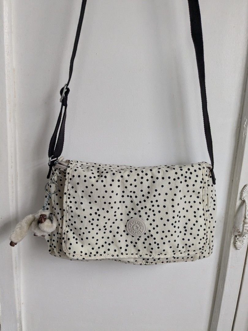 Kipling Syro Soft Dot Crossbody Bag (Category: Cross-body Bags) located in Quezon City. Submitted by nnncorner (Listing ID 1459321204, Image 2). Description: Original Kipling Syro Soft Dot Crossbody Bag Clean inside and outside No any issues Good as new! 100% Original! Strap down to bottom - 35 inches adjustable Length - 9 inches Width - 13 inches Original price 99$ / 6,000 in Philippine peso Water Resistant Snap and Zip Lock Closure This is so p